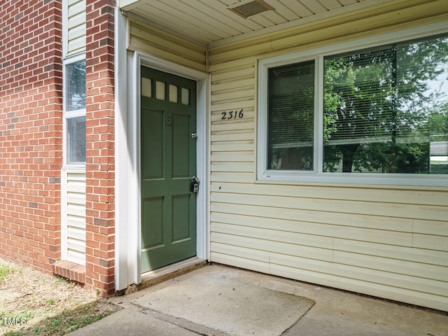 2316 Champion Ct, Raleigh, NC 27606 - property entrance featuring brick siding