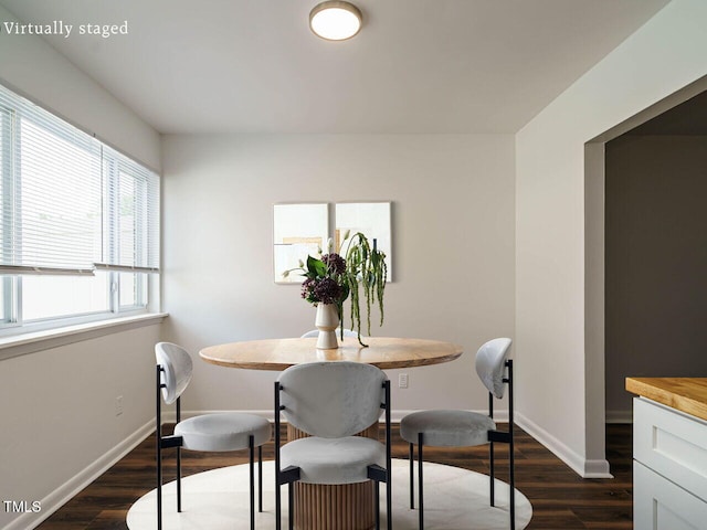 2316 Champion Ct, Raleigh, NC 27606 - dining space with dark wood-style floors and baseboards