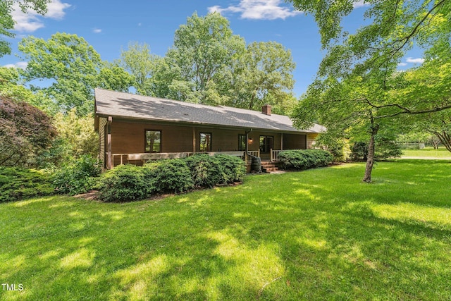 6971 Shady Creek Trl, Rougemont, NC 27572 - rear view of house with a lawn, a chimney, and covered porch