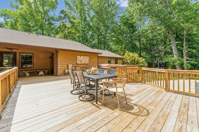 6971 Shady Creek Trl, Rougemont, NC 27572 - wooden deck featuring outdoor dining area, view of scattered trees, and ceiling fan