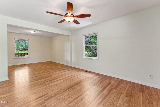 6971 Shady Creek Trl, Rougemont, NC 27572 - spare room featuring light wood-type flooring, ceiling fan, and baseboards