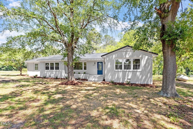 2003 Broadway Rd, Sanford, NC 27332 - view of front of home with metal roof and stucco siding