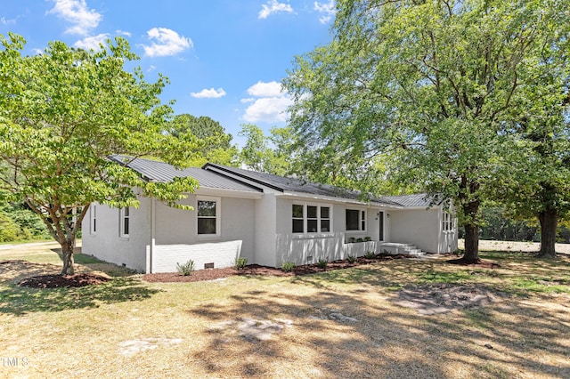 2003 Broadway Rd, Sanford, NC 27332 - view of front of home with metal roof, a standing seam roof, crawl space, and brick siding