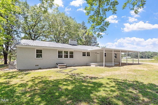 2003 Broadway Rd, Sanford, NC 27332 - rear view of property featuring crawl space, metal roof, a lawn, and brick siding