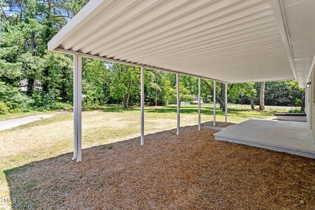 2003 Broadway Rd, Sanford, NC 27332 - view of patio featuring view of wooded area
