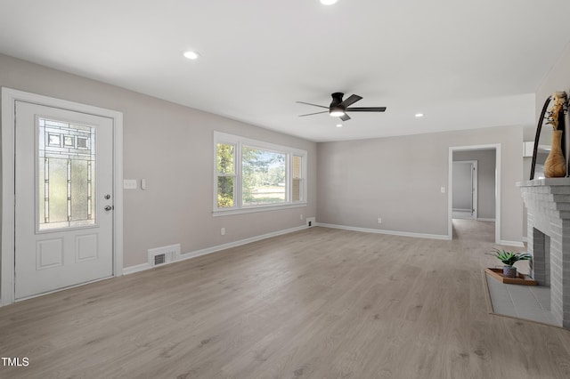 2003 Broadway Rd, Sanford, NC 27332 - unfurnished living room featuring ceiling fan, baseboards, a brick fireplace, light wood finished floors, and recessed lighting