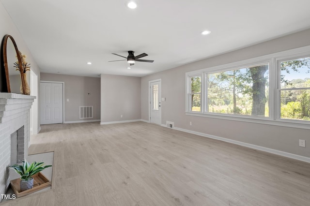 2003 Broadway Rd, Sanford, NC 27332 - unfurnished living room with baseboards, a ceiling fan, a brick fireplace, and recessed lighting