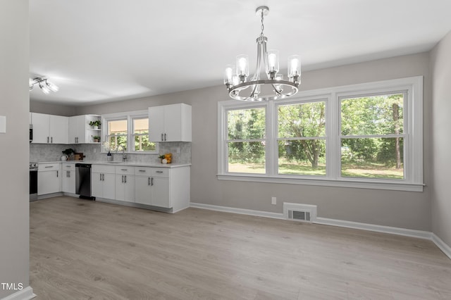 2003 Broadway Rd, Sanford, NC 27332 - kitchen featuring a sink, a chandelier, open shelves, light countertops, and dishwashing machine