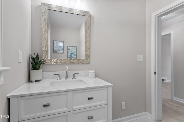 2003 Broadway Rd, Sanford, NC 27332 - bathroom featuring vanity, baseboards, and wood finished floors