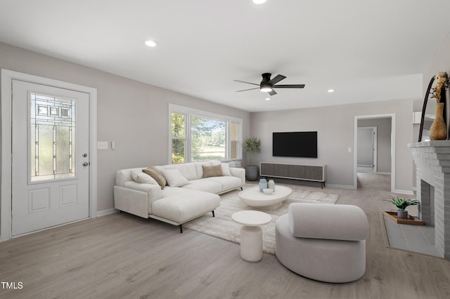 2003 Broadway Rd, Sanford, NC 27332 - living area with ceiling fan, wood finished floors, a fireplace, baseboards, and recessed lighting
