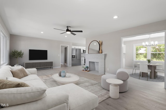 2003 Broadway Rd, Sanford, NC 27332 - living area with light wood-style floors, a chandelier, recessed lighting, a ceiling fan, and baseboards