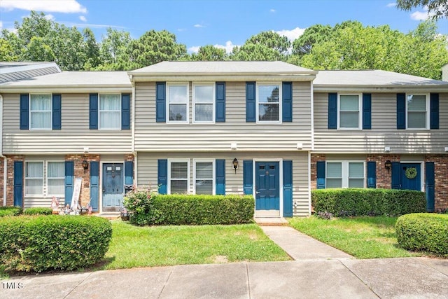 134 Luxon Pl, Cary, NC 27513 - view of property with a front yard and brick siding