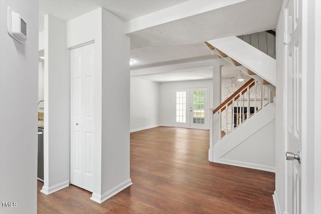 134 Luxon Pl, Cary, NC 27513 - corridor featuring wood finished floors, stairway, and a textured ceiling