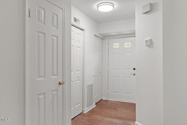 134 Luxon Pl, Cary, NC 27513 - hallway featuring wood finished floors and baseboards