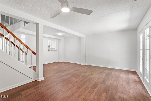 134 Luxon Pl, Cary, NC 27513 - spare room with wood finished floors, a textured ceiling, stairs, and a ceiling fan