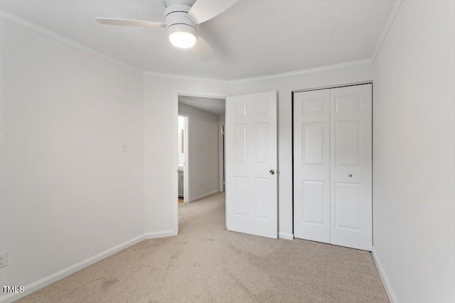 134 Luxon Pl, Cary, NC 27513 - unfurnished bedroom featuring light colored carpet, crown molding, a closet, and ceiling fan