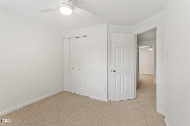 134 Luxon Pl, Cary, NC 27513 - unfurnished bedroom with light carpet, ornamental molding, a closet, and ceiling fan