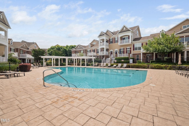 10310 Sablewood Dr Unit 111, Raleigh, NC 27617 - community pool with a residential view, a patio, and a pergola