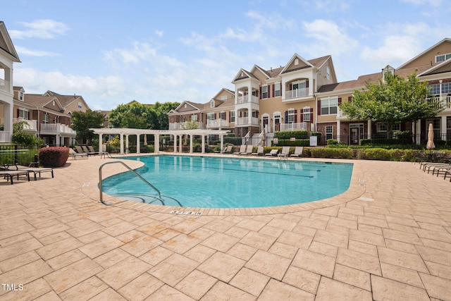 10310 Sablewood Dr Unit 111, Raleigh, NC 27617 - community pool featuring a pergola, a residential view, and a patio