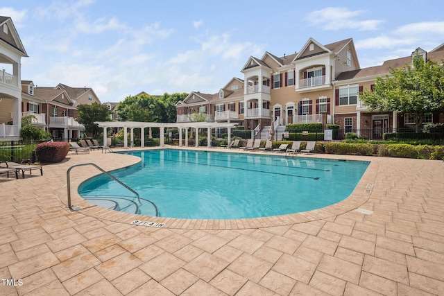 10310 Sablewood Dr Unit 111, Raleigh, NC 27617 - community pool with a patio, a residential view, and a pergola