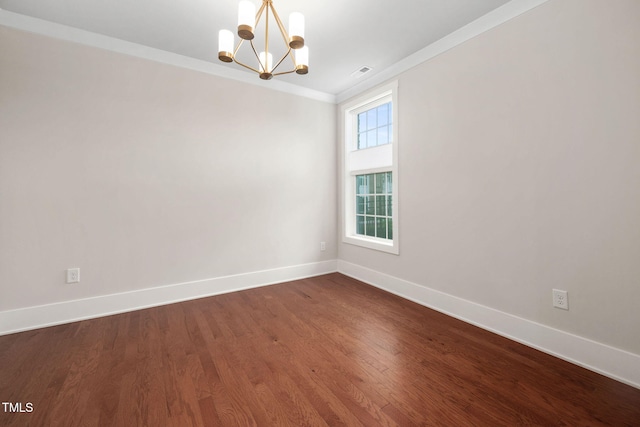 10310 Sablewood Dr Unit 111, Raleigh, NC 27617 - empty room featuring a chandelier, baseboards, ornamental molding, and dark wood-style flooring
