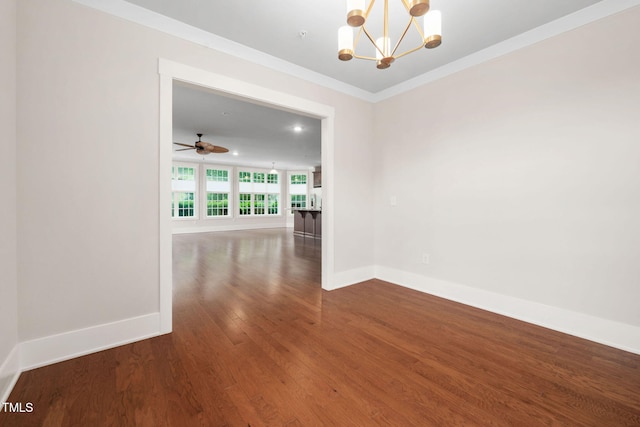10310 Sablewood Dr Unit 111, Raleigh, NC 27617 - spare room featuring a chandelier, wood finished floors, baseboards, ornamental molding, and ceiling fan