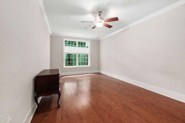 10310 Sablewood Dr Unit 111, Raleigh, NC 27617 - unfurnished room featuring crown molding, baseboards, wood finished floors, and a ceiling fan