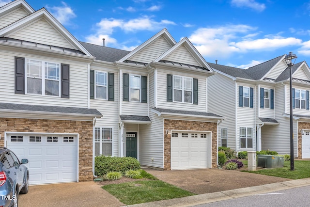2513 Asher View Ct, Raleigh, NC 27606 - townhome / multi-family property featuring stone siding, an attached garage, asphalt driveway, and cooling unit