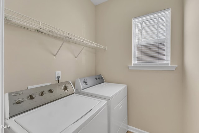 2513 Asher View Ct, Raleigh, NC 27606 - laundry area with washing machine and clothes dryer, plenty of natural light, and baseboards