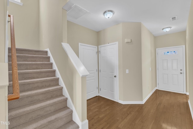 2513 Asher View Ct, Raleigh, NC 27606 - entryway with wood finished floors, baseboards, and stairway