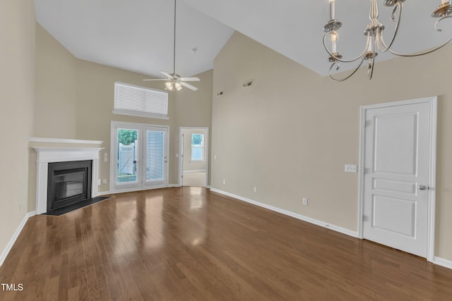 2513 Asher View Ct, Raleigh, NC 27606 - unfurnished living room with ceiling fan, wood finished floors, high vaulted ceiling, and baseboards