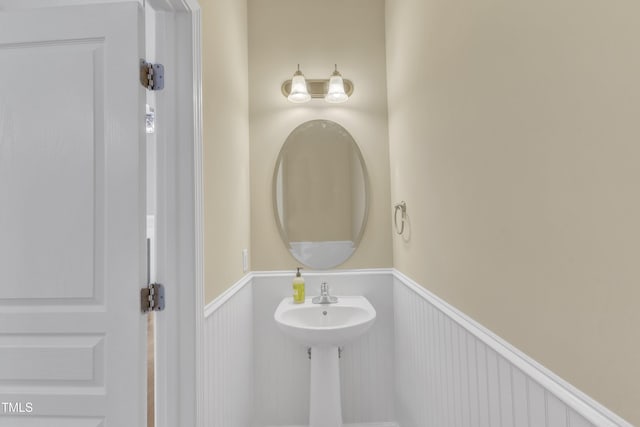 2513 Asher View Ct, Raleigh, NC 27606 - bathroom featuring wainscoting and a sink