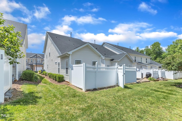 2513 Asher View Ct, Raleigh, NC 27606 - rear view of property with a gate and roof with shingles