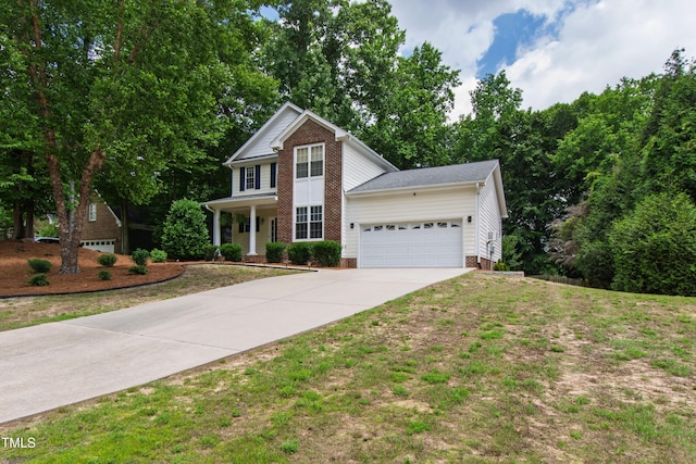 3821 La Costa Way, Raleigh, NC 27610 - view of front of home with driveway, an attached garage, and covered porch