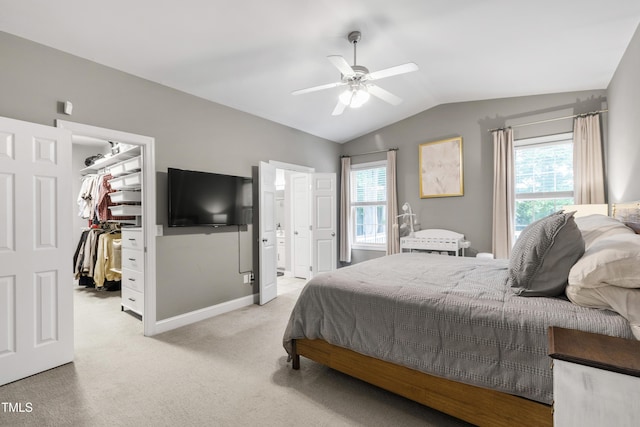 3821 La Costa Way, Raleigh, NC 27610 - bedroom with a walk in closet, vaulted ceiling, light colored carpet, a closet, and connected bathroom
