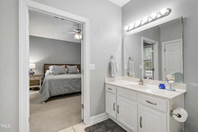 3821 La Costa Way, Raleigh, NC 27610 - ensuite bathroom with vanity, ceiling fan, and tile patterned flooring