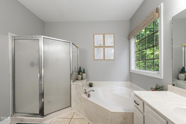 3821 La Costa Way, Raleigh, NC 27610 - full bath featuring vanity, a stall shower, a garden tub, and tile patterned floors