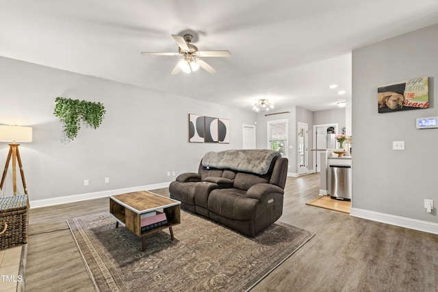 3821 La Costa Way, Raleigh, NC 27610 - living area with a ceiling fan, wood finished floors, and baseboards