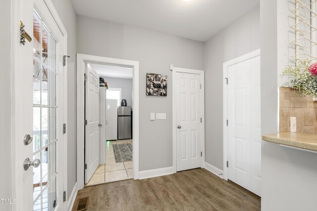 3821 La Costa Way, Raleigh, NC 27610 - foyer with light wood-type flooring and baseboards