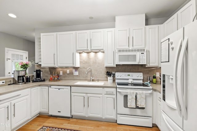 3821 La Costa Way, Raleigh, NC 27610 - kitchen with white appliances, a sink, white cabinets, tasteful backsplash, and recessed lighting