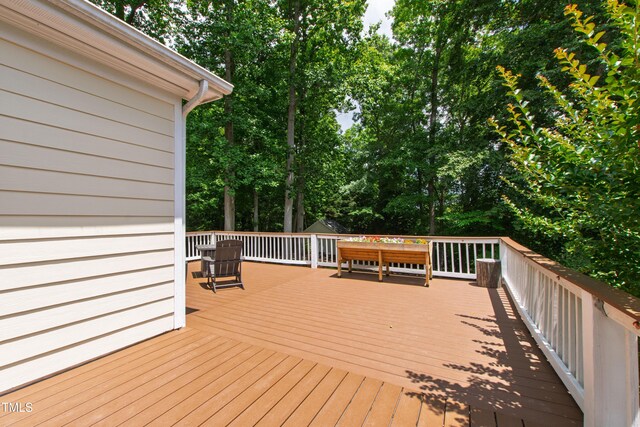 3821 La Costa Way, Raleigh, NC 27610 - wooden deck featuring view of scattered trees