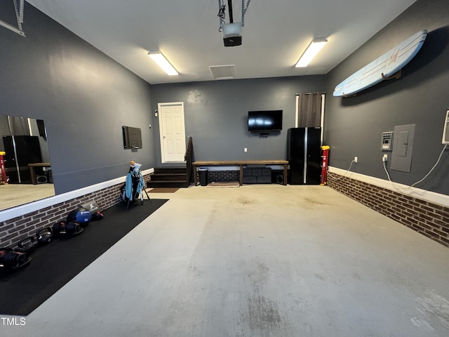 3821 La Costa Way, Raleigh, NC 27610 - garage featuring a garage door opener and electric panel