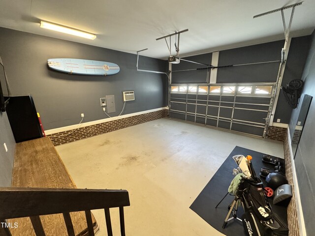 3821 La Costa Way, Raleigh, NC 27610 - garage featuring a wall mounted air conditioner and a garage door opener
