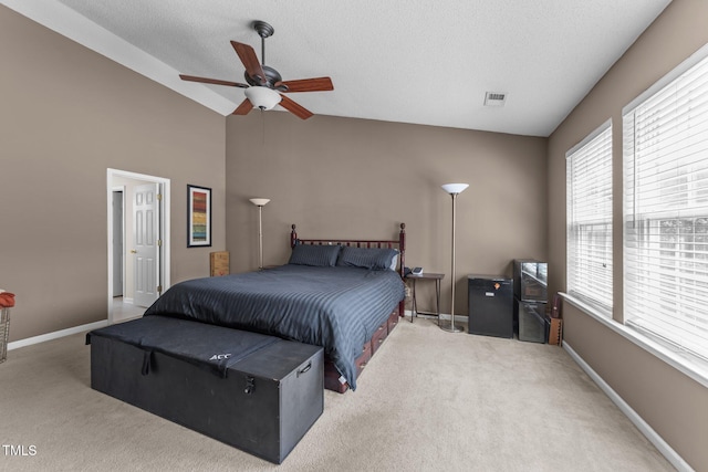 carpeted bedroom featuring vaulted ceiling, baseboards, a textured ceiling, and ceiling fan
