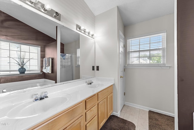 bathroom with double vanity, baseboards, tile patterned floors, a bath, and a shower