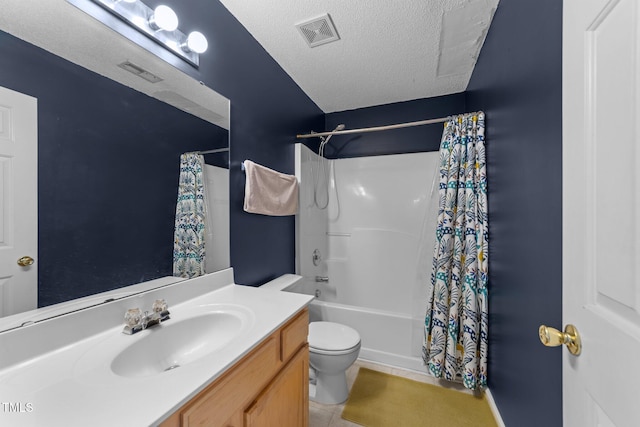 bathroom featuring toilet, vanity, a textured ceiling, shower / bath combo, and tile patterned flooring