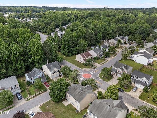 aerial view of residential area with a forest