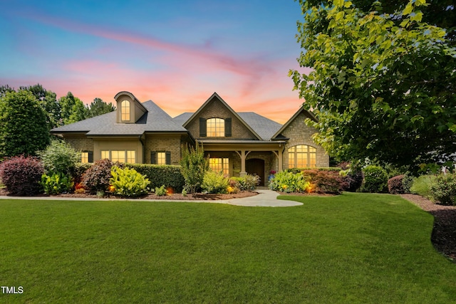 238 Michelangelo Way, Cary, NC 27518 - view of front of property featuring brick siding, a yard, and stone siding