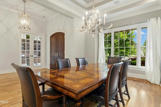 238 Michelangelo Way, Cary, NC 27518 - dining area with a chandelier, french doors, light wood finished floors, ornamental molding, and baseboards