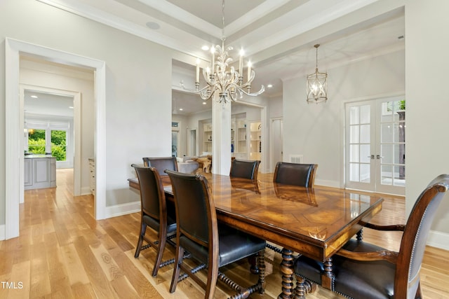 238 Michelangelo Way, Cary, NC 27518 - dining space with french doors, a chandelier, ornamental molding, light wood finished floors, and baseboards